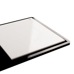 Close-up of the layered gloss black acrylic base plate and laser-cut vector frame detailing