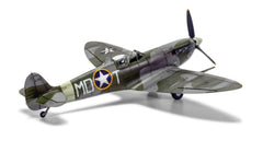 Built Airfix 1:48 Supermarine Spitfire Mk.Vb model in RAF camouflage with US star markings, three-quarter front view