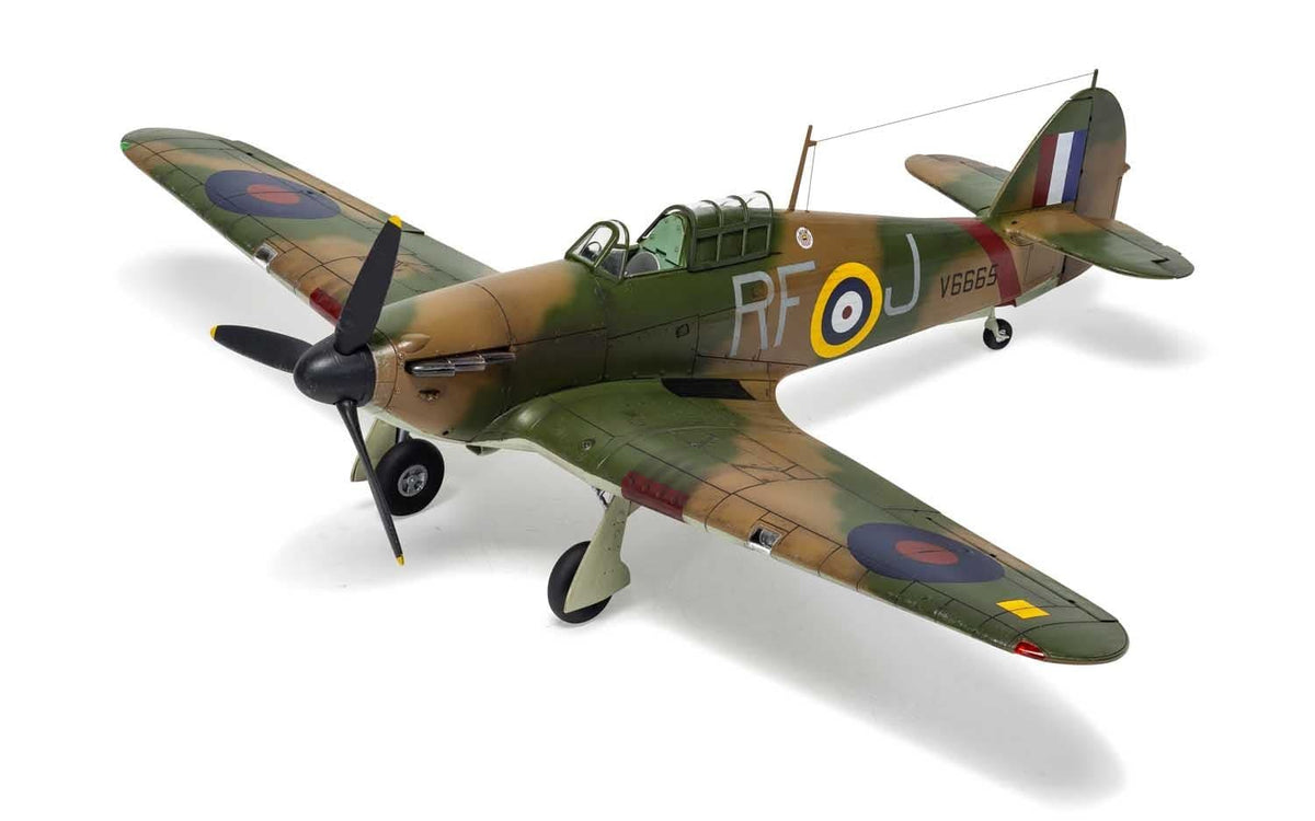 Built Airfix 1:48 Hawker Hurricane Mk.I model in brown and green RAF camouflage, three-quarter front view