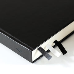 Corner detail of the black Bullet Journal Edition 2 hardcover showing the three page markers