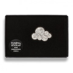 The cumulus cloud brooch presented inside the maker's black card and velvet gift box