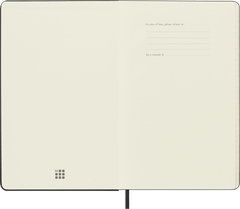 Moleskine Classic notebook opened at the front flyleaf showing the In case of loss notice