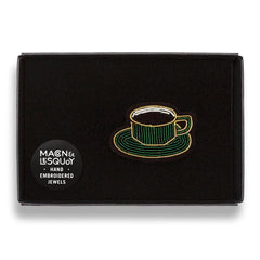 The cup of coffee brooch presented inside the maker's black card and velvet gift box